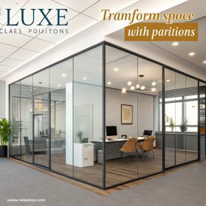 a glass wall with a desk and chairs in it