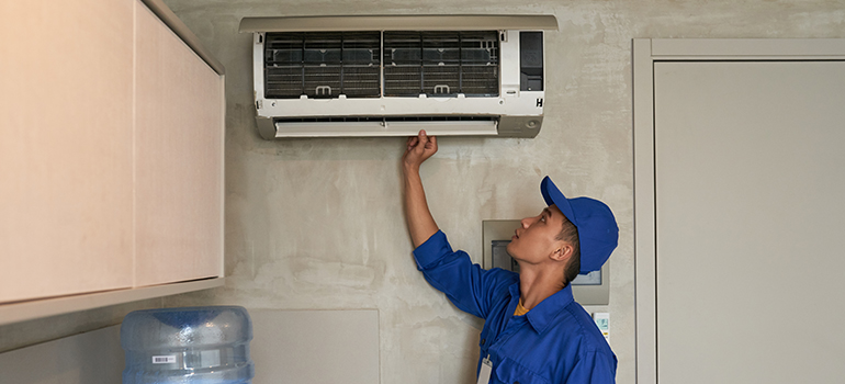 professional technician checking ac for service Dubai